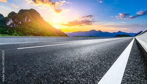 Mountain Scenery Overlook A journey on a smooth asphalt  with stunning mountain scenery and a vibrant sunset.
