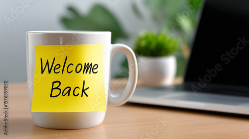 Welcome Back Coffee Mug on Office Desk with Laptop