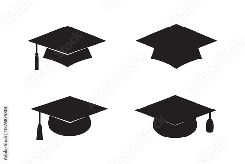 Set of four black graduation caps or academic mortarboards with tassels