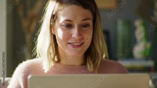 Woman using laptop at home