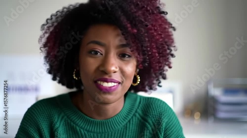 Woman with curly hair smiling