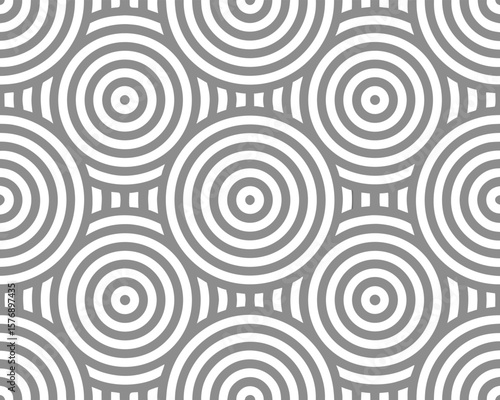Seamless geometric pattern featuring concentric circles in shades of gray with a modern background design.