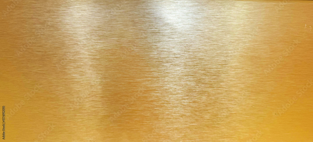 Brushed gold metal texture with horizontal grain and subtle reflections, ideal for backgrounds, luxurious designs, and industrial aesthetics. Brushed gold metal texture with horizontal grain and subtle reflections, ideal for backgrounds, luxurious designs, and industrial aesthetics.