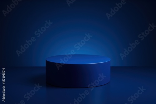 Minimalist blue cylindrical podium or stage with soft lighting and a dark background for product display