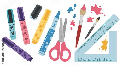 Creative art supplies arrangement: markers, scissors, paint brushes, and ruler