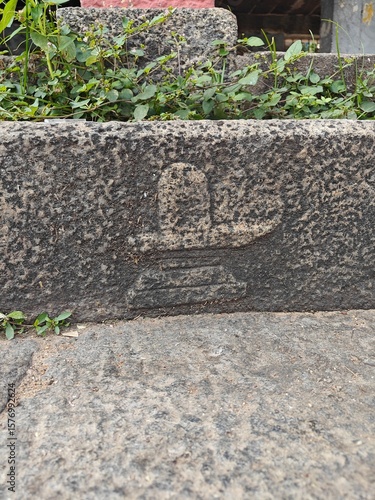 A spiritually resonant view of Thirukazhukundram, Tamil Nadu, India, capturing both the hilltop Vedagiriswarar Temple and the ancient foothill temple complex. The hill temple, dedicated to Lord Shiva,