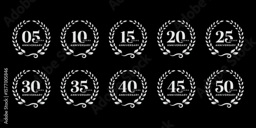 Ten circular logos celebrate 5, 10, 15, 20, 25, 30, 35, 40, 45, and 50 year anniversaries, each featuring a laurel wreath design.
