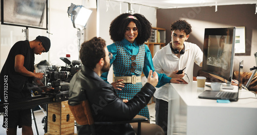 Fotografie Director, production team and discussion with actress for instructions, direction or plot in studio