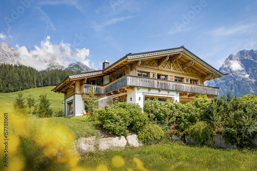 Wooden chalet in the alps on a summer day