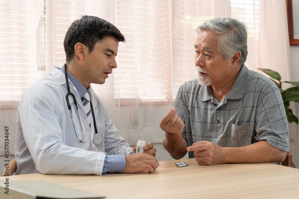 Fototapeta premium Doctor explaining to use medical information with elderly patient after health check at home visit