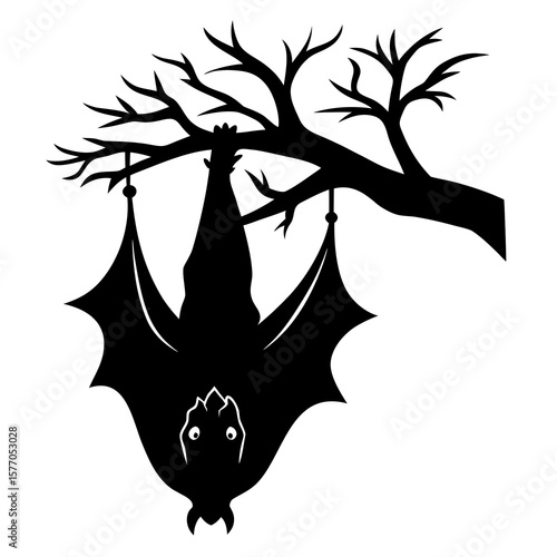 Black bat hanging from bare tree branch upside down