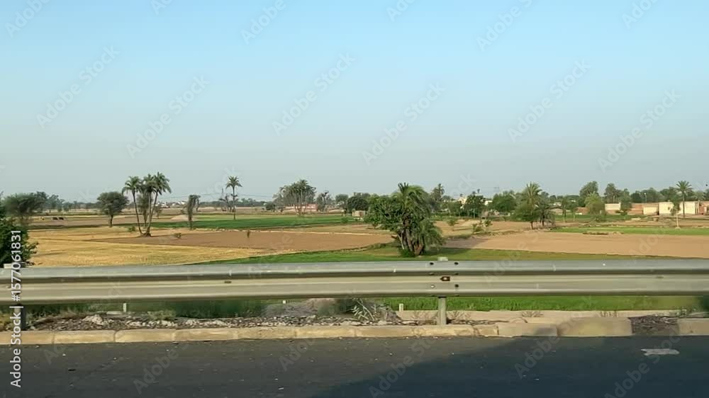 landscape view of fields and main highway road landscape view of fields and main highway road