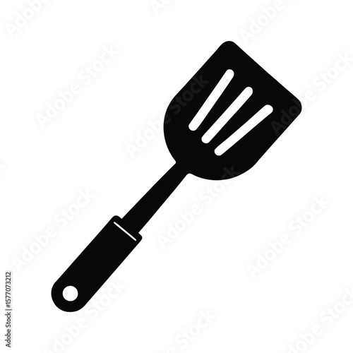 Black silhouette of a slotted spatula isolated on white background