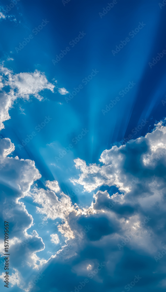 Sun rays breaking through a partly cloudy sky Sun rays breaking through a partly cloudy sky