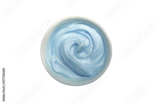 a bowl of blue cream on a white surface