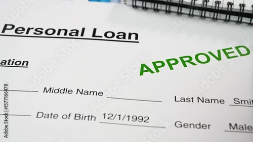 Reviewing the personal loan approval letter.