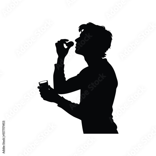 Silhouette of a man swallowing a pill while holding a glass of water