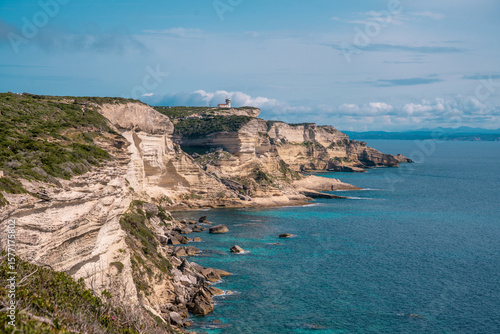 White coastal cliffs and azure waters from scenic Promenade des Falaises viewpoint near Bonifacio