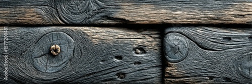 Close up reveals texture and grain of weathered wooden boards, some showing a slight charring or darkening effect