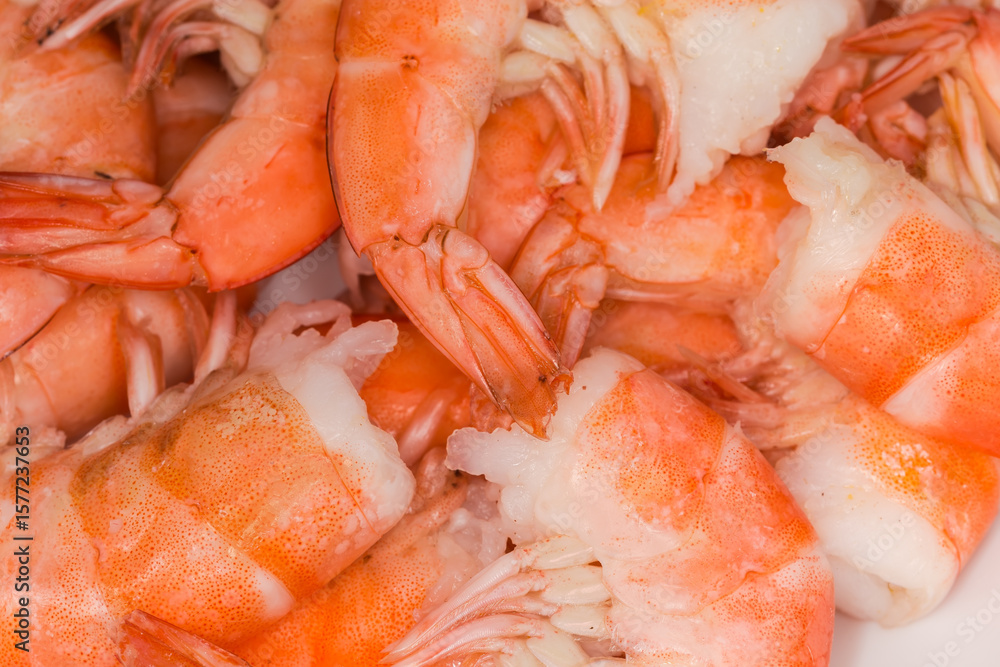 Heap of boiled unshelled tails king prawns close-up Heap of boiled unshelled tails king prawns close-up