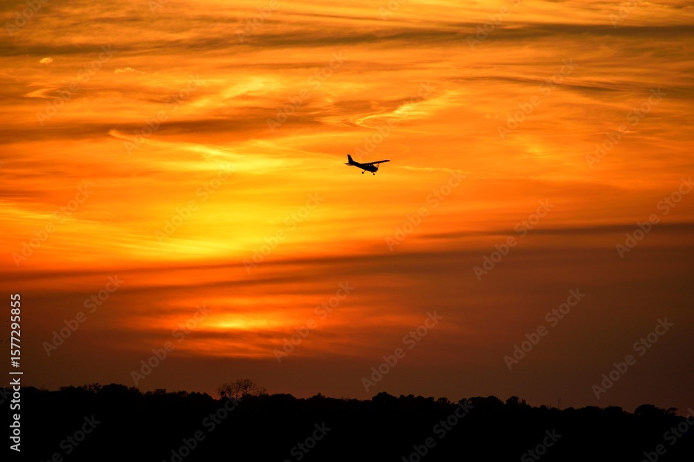 Fototapeta premium sunset in the sky showing a plane