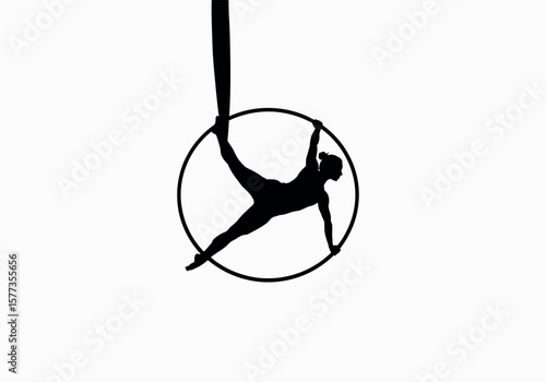 Silhouette of woman performing aerial hoop dance in black against a bright white background showing artistic expression