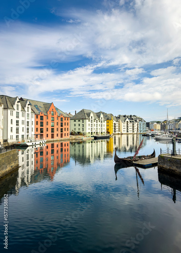 Brosundet canal in Ålesund, Norway, with Art Nouveau architecture reflecting on water.