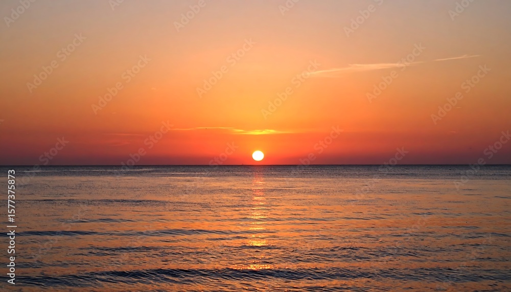 Sunrise or sunset over calm ocean Sunrise or sunset over calm ocean