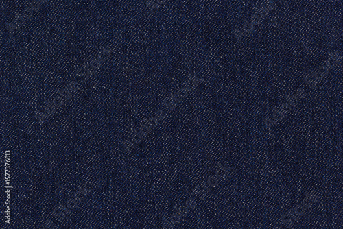 Dark blue denim fabric with detailed weave texture, classic textile material for fashion and design