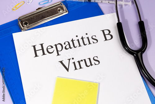 A Paper with “Hepatitis B Virus” Title in Clipboard Set on the Desk with Stethoscope – Viral Liver Infection Concept