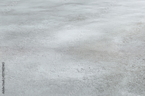 Minimalist grey concrete texture. Abstract industrial backdrop, versatile for backgrounds or product displays. Clean, modern, and neutral.
