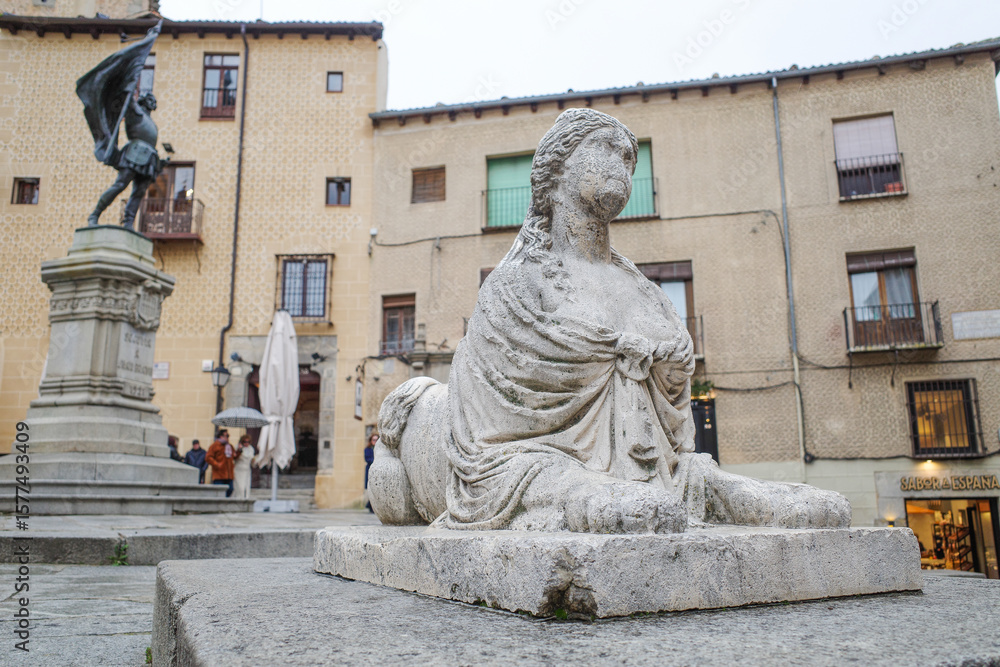 Obraz premium Segovia, Spain - 3 March, 2025: Sirenas de Segovia Sculpture (Segovia Mermaid) and Plaza Medina del Campo, Segovia