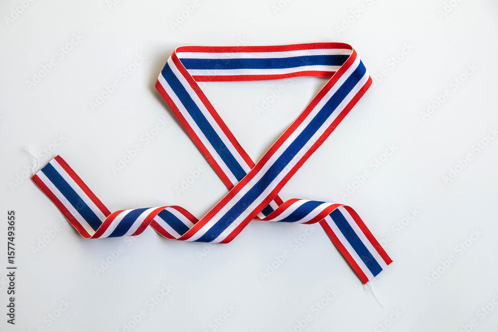Obraz premium Thai flag striped ribbon shaped into a heart on a white background. Represents national pride, patriotism, and Thai cultural identity. Ideal for Thai national holidays, educational content