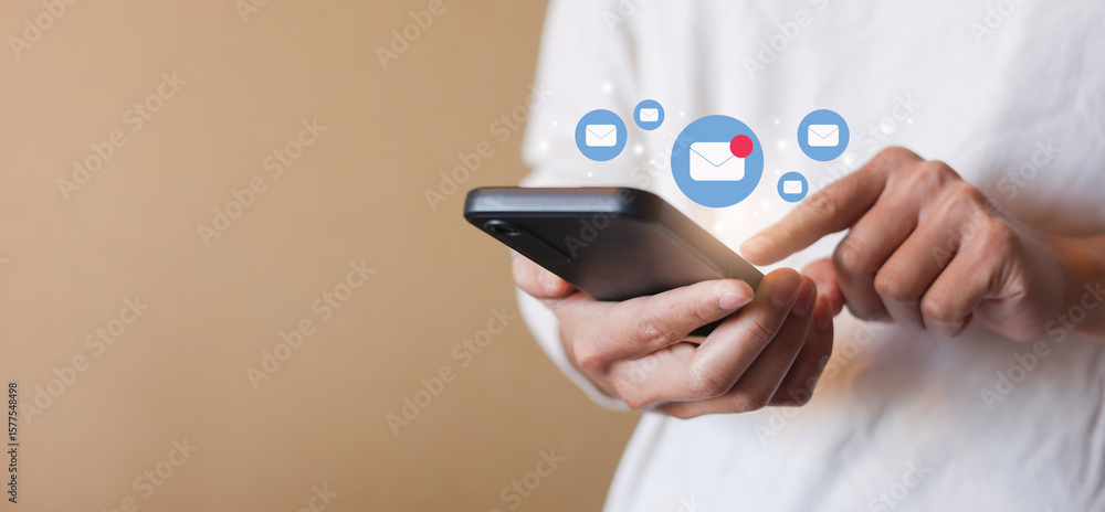 close up businessman holding smartphone and checking email online on web with virtual interface technology concept close up businessman holding smartphone and checking email online on web with virtual interface technology concept