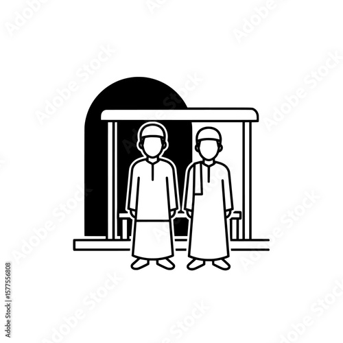 Two pilgrims standing at entrance of mosque