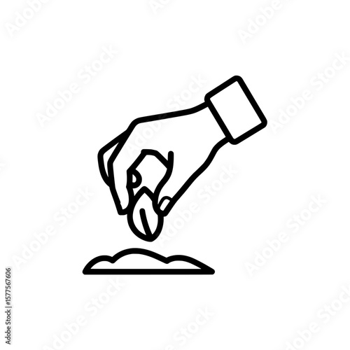 hand planting seed in soil for gardening or farming