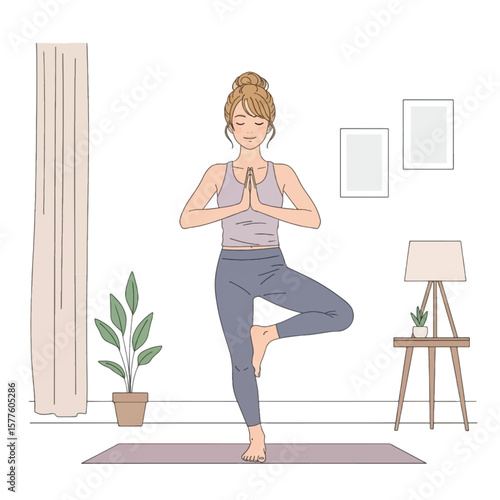 Woman practicing yoga tree pose in a cozy living room.
