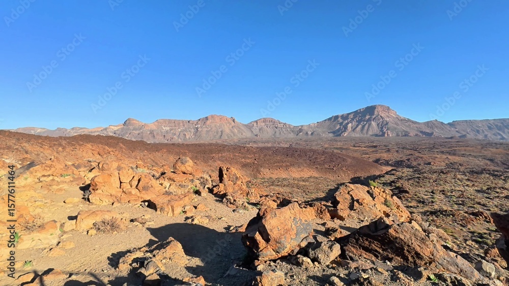 Naklejka premium The breathtaking views of rocky terrain and majestic mountains are truly aweinspiring beneath a clear blue sky