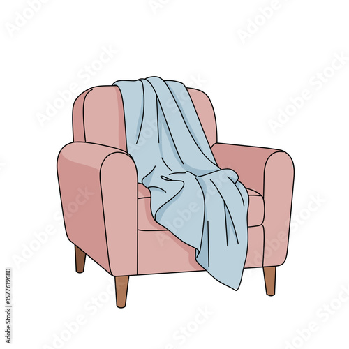 Cozy pink armchair with a blue blanket draped over it  