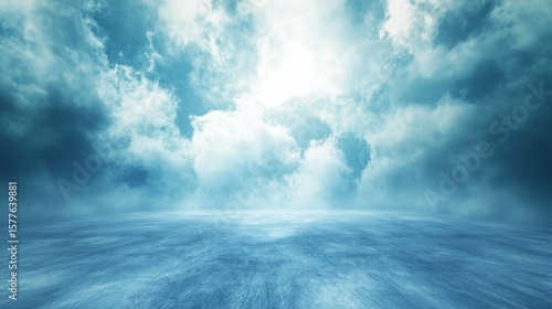 Fototapeta Naklejka Na Ścianę i Meble -  A vast, open, and empty concrete floor with a blue sky and white clouds in the background.