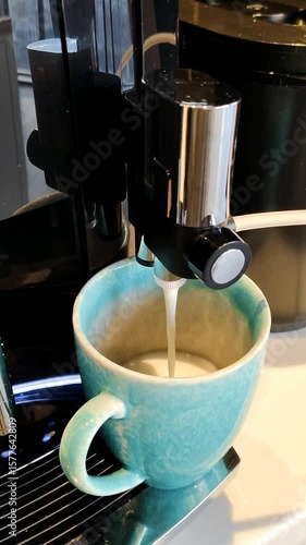 Close up preparing coffee machine ceramic cup mug turquoise blue color. Morning breakfast beverage cappuccino latte milk foam, hot coffee, 