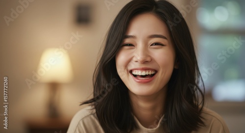 Free Download A gigapixel image of a young woman, radiating genuine happiness and warmth with a contagious laugh. - GFXLoad