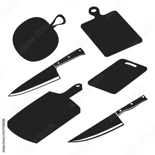 Black kitchen knives and cutting boards arranged chopping