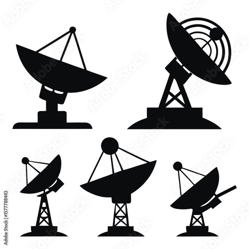 Black satellite dishes arrayed against white radar