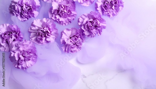 Purple carnations on a marbled surface with smoky purple background