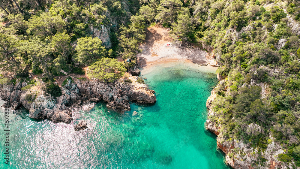 Fototapeta premium defaultKorsan Cove. Located in the Kumluca district, Korsan Cove ( K is a small and clean bay containing the ruins of the Ancient City of Melanippe, to the west of Gelidonya Feneri. Korsan Koyu Karaoz