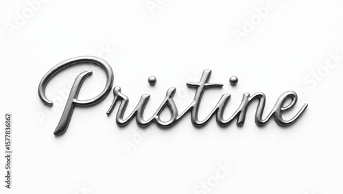 Metallic cursive word pristine lies on a flat, clean surface