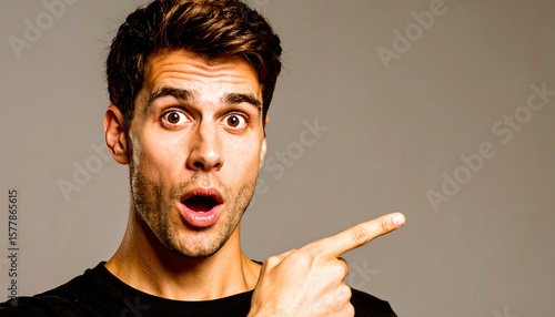 Surprised man pointing to the right