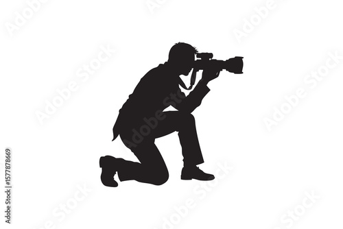 Photographer Kneeling Silhouette Taking Photo with Professional Camera