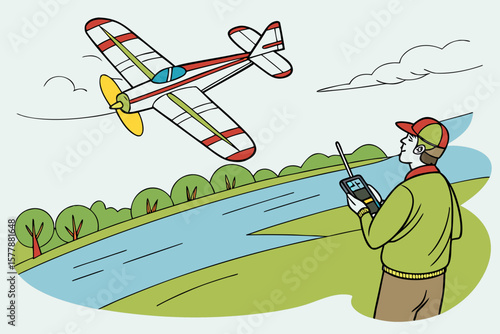 A man controls a model airplane with a remote control over a river with trees and a cloudy sky above
